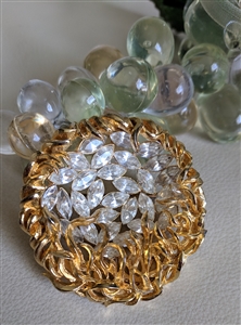 Vintage 1960s gold tone sunburst brooch with clear marquise glass stones