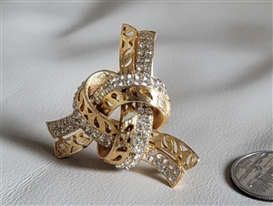 Vintage elegant knotted ribbon gold tone statement brooch front view