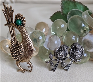 Vintage Ambassador gold tone roadrunner brooch and pave crystal finches on branch brooch set