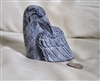Hand sculpted gray beeswax crow candle by Big Dipper Wax Works