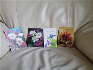 Four unique vintage Hallmark floral greeting note cards 1980s new old stock made in USA displayed open and closed