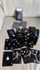 Giorgio Armani vintage deck of Black background playing cards 54 with models and perfume decor .