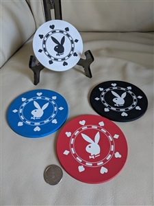 Preowned vintage Playboy Bunny rubber coaster set with gambling chip design for display