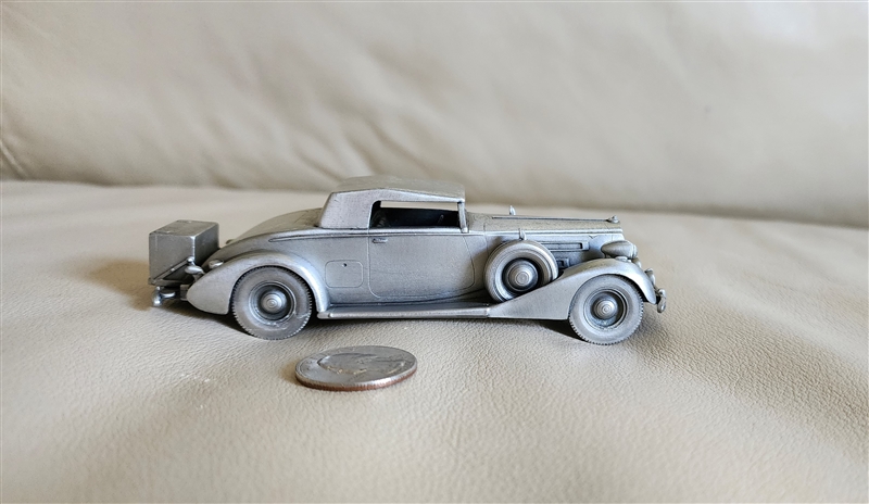 Vintage 1975 pewter 1937 Packard Coupe model car by Danbury Mint England showing authentic underside hallmark and detailed front grille design