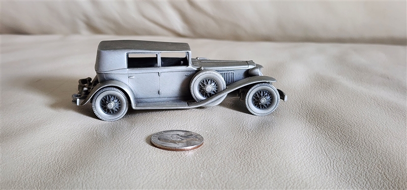 Vintage 1975 pewter 1929 Cord L29 model car by Danbury Mint England showing authentic underside hallmark and side profile design