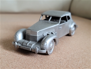 Vintage 1975 pewter 1937 Cord 812 model car by Danbury Mint England showing authentic underside hallmark and detailed front grille design