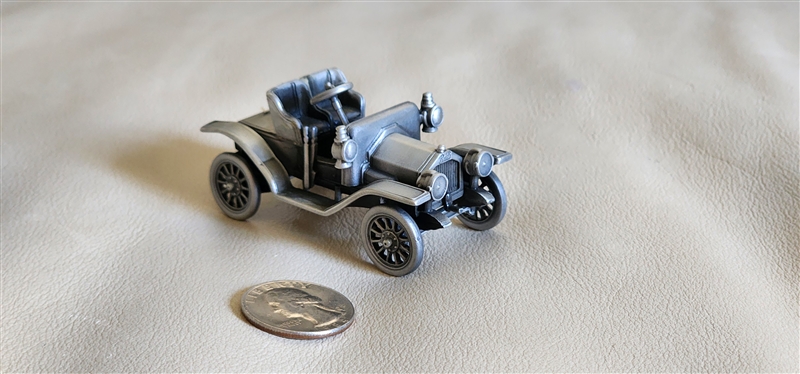 Vintage 1975 pewter 1911 Buick model car by Danbury Mint England showing authentic underside hallmark and detailed brass era design