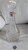 Vintage pressed glass decanter with leaves and vines design and fleur de lis stopper