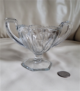 vintage clear pressed glass footed sugar bowl featuring vertical cuts beaded rim dual handles and a hexagonal pedestal base from the 1950s