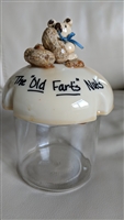 Vintage Brockway Machine Bottle Co glass jar with a plastic lid featuring a bear holding peanuts decoration