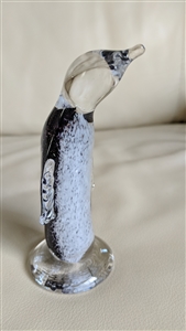 This preowned vintage art glass penguin features a stunning combination of white purple and black colors
