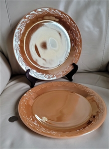 Preowned set of two vintage Anchor Hocking Peach Lustre-Laurel dinner plates featuring an embossed laurel design