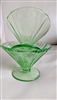 Two green transparent footed sherbet glasses with a ribbed cone shape on a neutral background showing the Parrot Green pattern