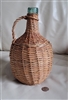 Vintage aqua green glass woven wicker basket wrapped decanter with handle