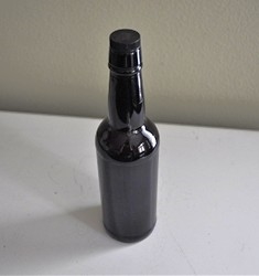 Vintage brown glass bottle with cork stopper for collectible storage and home decor