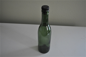 Vintage brown glass bottle with cork stopper for collectible storage and home decor
