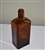 Vintage Bodegas California amber glass paneled spirit bottle standing approximately 9 inches tall with embossed post-Prohibition warning and rectangular base