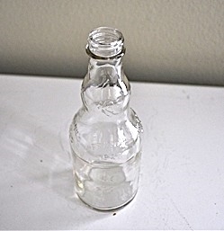 Vintage 1970s Frank’s 1920 commemorative embossed glass bottle with rippled neck.