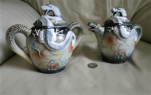 Japanese Moriage Dragonware porcelain creamer and lidded sugar bowl set with raised 3D white dragons and textured handles