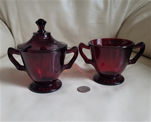 Anchor Hocking Royal Ruby red glass two piece sugar bowl set featuring a lidded bowl and an open bowl from the 1950s