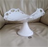 Westmoreland milk glass banana stand with diamond pattern and open lace edge