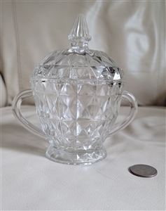 Jeannette clear pressed glass covered sugar bowl in Windsor Diamond pattern with handles and footed base