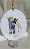Berta Hummel Goebel 2002 oval Christmas ornament a boy with snowman.