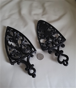 Wilton and other black metal trivets hot plates table setting vintage collecitbles
