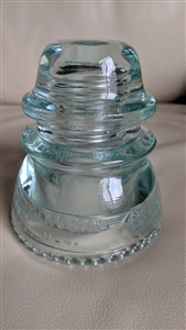 This preowned vintage aqua glass Hemingray 42 utility insulator features a classic bell shape and industrial design