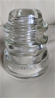 This preowned vintage clear glass Hemingray 46 utility insulator features a classic industrial design
