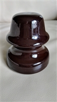 This preowned vintage brown ceramic utility insulator features a classic bell shape and industrial design