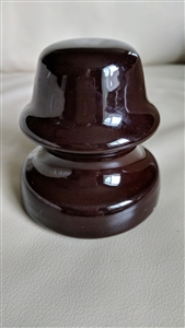 This preowned vintage brown ceramic utility insulator features a classic bell shape and industrial design