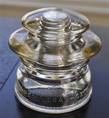 Yellow Hemingray 53 glass insulator with embossed text