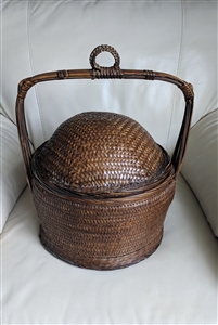 Antique Chinese woven bamboo wedding basket with domed lid and high arched handle