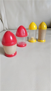 Two color sets of four vintage 1950s U.A. Kasin rocket-style salt and pepper shakers