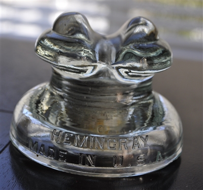 This preowned vintage Hemingray D-512 aqua glass utility insulator features its classic embossed design