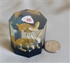 Hexagonal clear Lucite paperweight encasing a golden rabbit figurine with blue base layer and Maltese Cross emblem on top