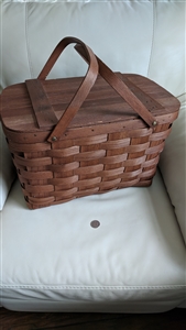 Vintage Basketville Putney Vermont wood splint lidded picnic basket showing dual swing handles and brown finish