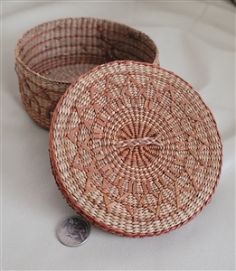 Vintage round hand woven lidded grass trinket basket box with burgundy geometric accents