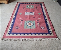 hand-woven Dhurrie rug made in India featuring a ceremonial elephant design with global folk art imagery and artisan origin texture