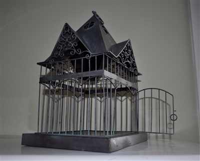 Metal bird cage display in Victorian house style elegant design display for indoor and outdoor setting