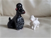 Large and small Puddle miniature dogs in porcelain and terracotta finish.