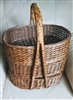Vintage mid century hand woven tiered gathering basket set with three oval stackable baskets and bentwood handle