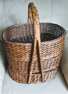 Vintage mid century hand woven tiered gathering basket set with three oval stackable baskets and bentwood handle