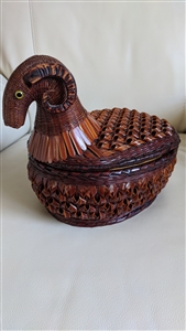 Handwoven vintage wicker ram shaped lidded basket with curved horns and inset eyes showing two piece construction