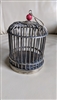 Metal decorative cage with butterflies decor.