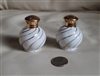 Salt and pepper shakers, white porcelain in swirl design with gold accents table setting vintage accessories.