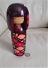 preowned vintage sato suigai sosaku kokeshi doll with red camellia blossoms