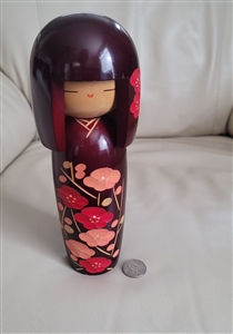 preowned vintage sato suigai sosaku kokeshi doll with red camellia blossoms