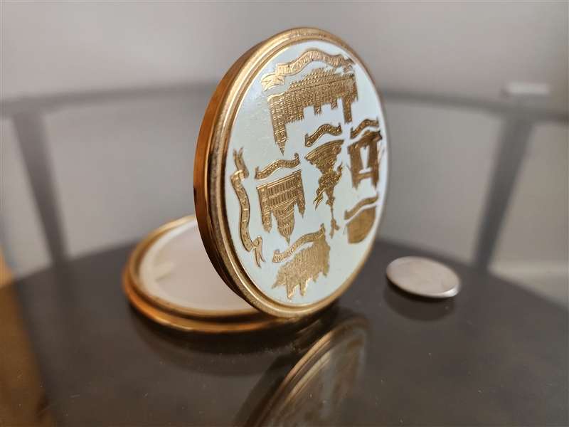 Vintage Kigu London powder compact with gold architectural silhouettes on white enamel